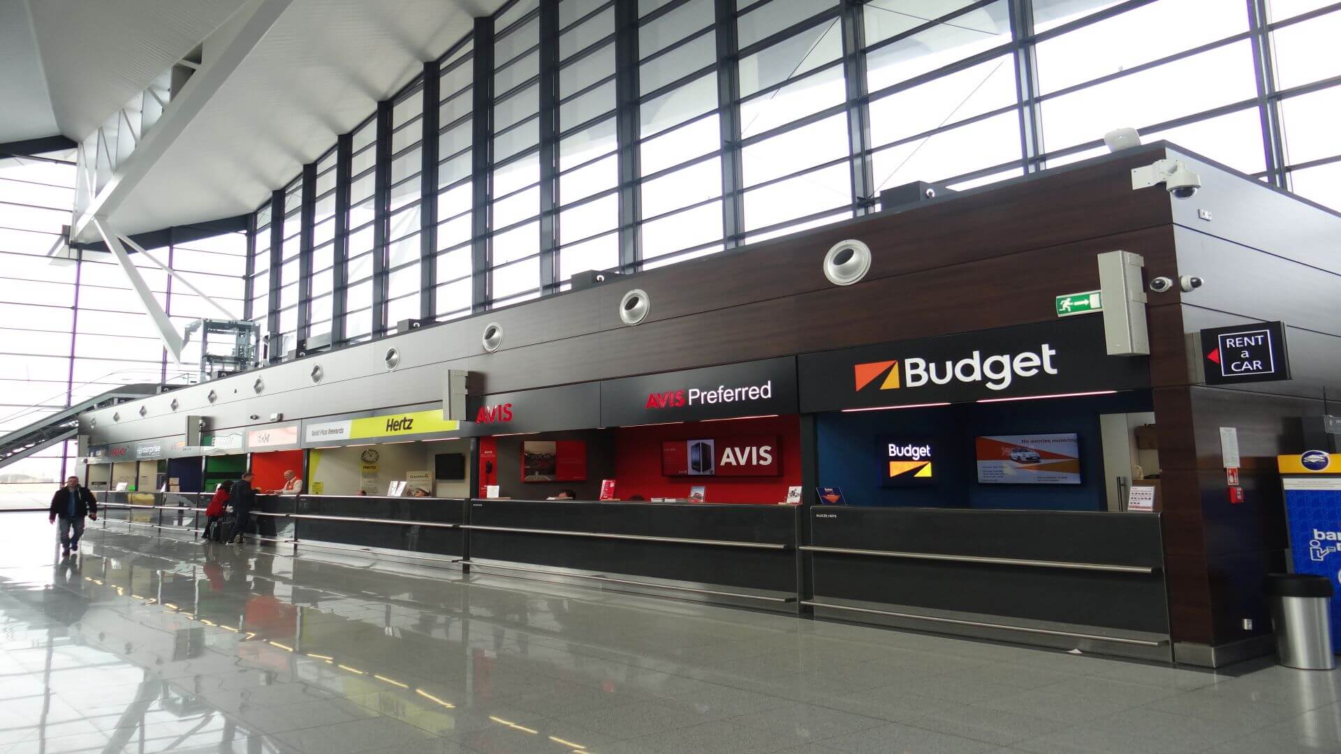 The car rental service is right at the exit of the arrivals.